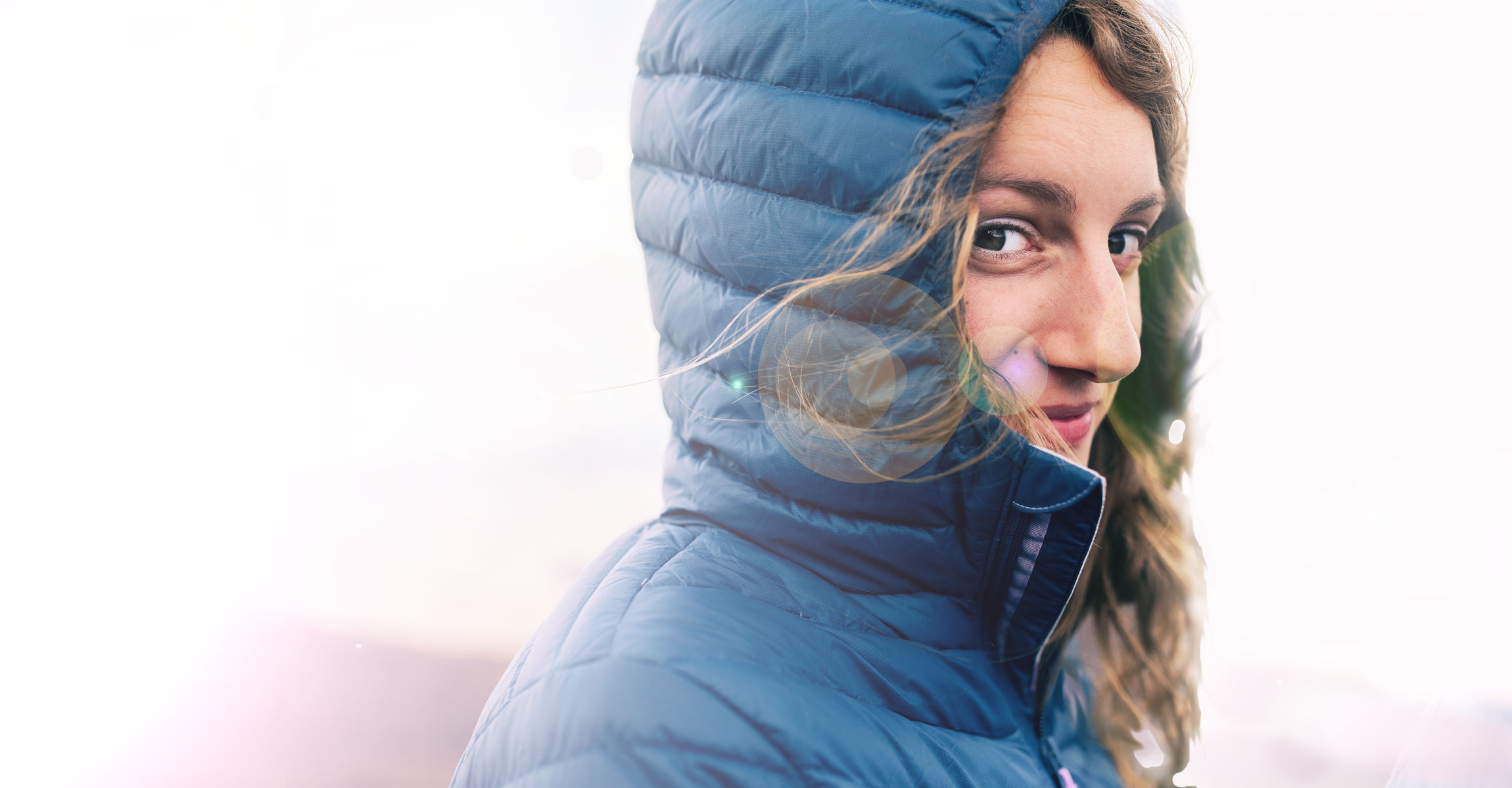 woman in blue hooded coat