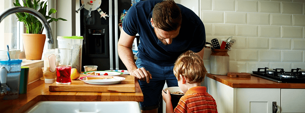 man and child in kitchen