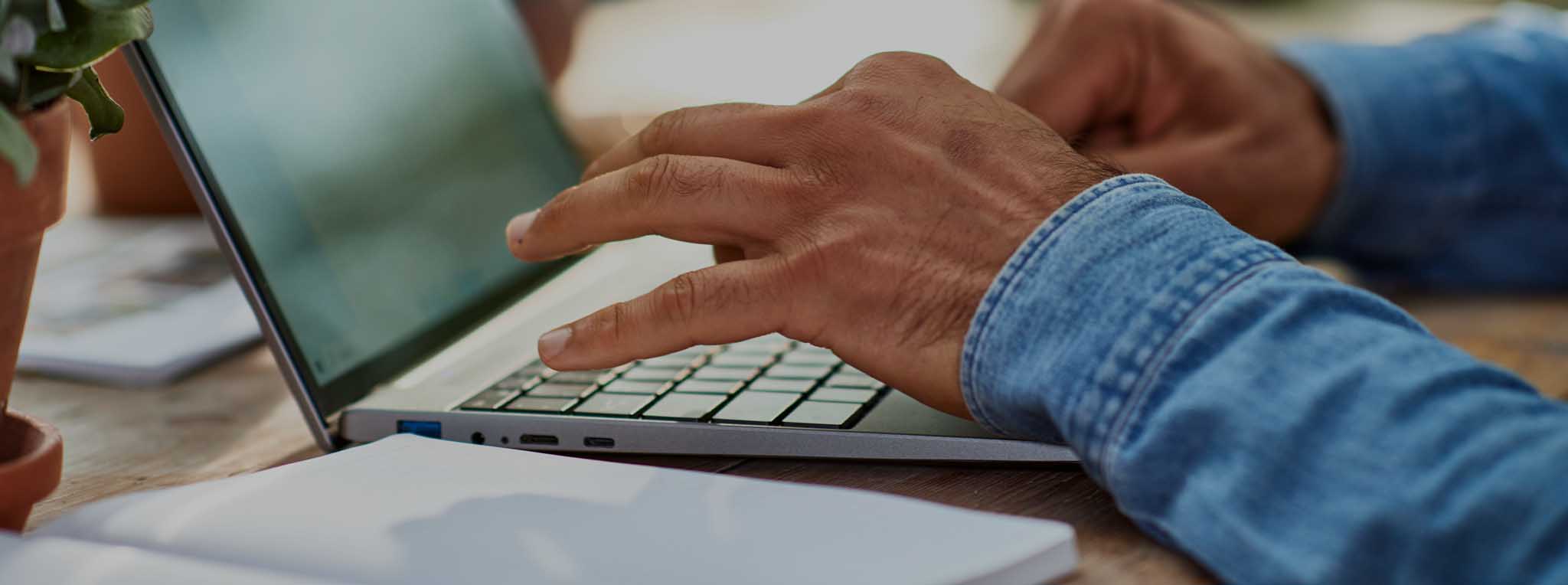 man typing on keyboard