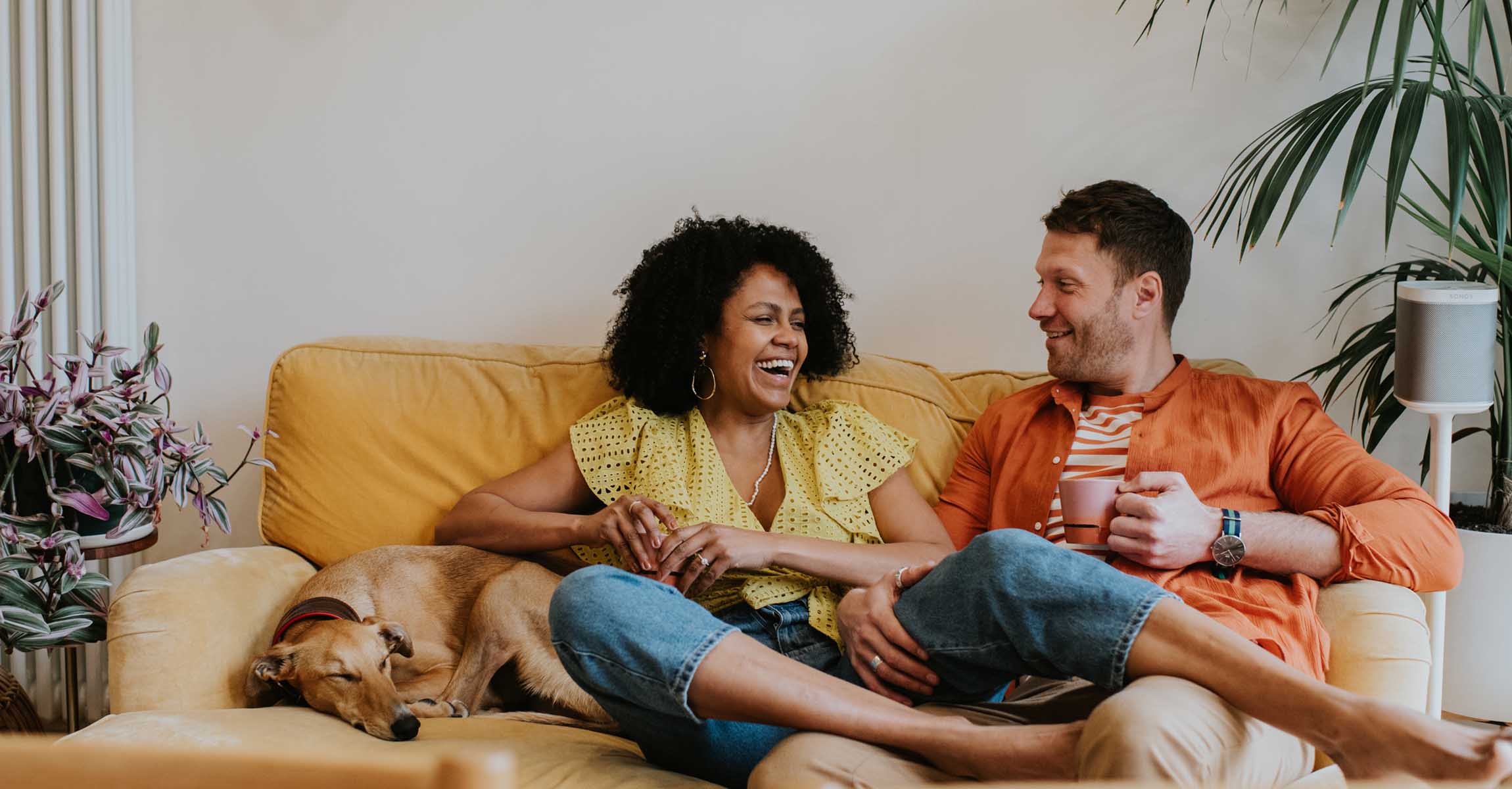 Couple on sofa with dog