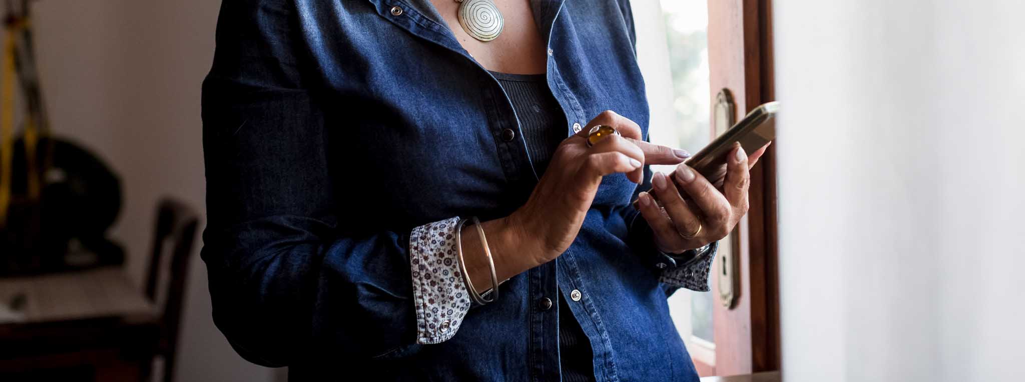 Older woman hands holding phone