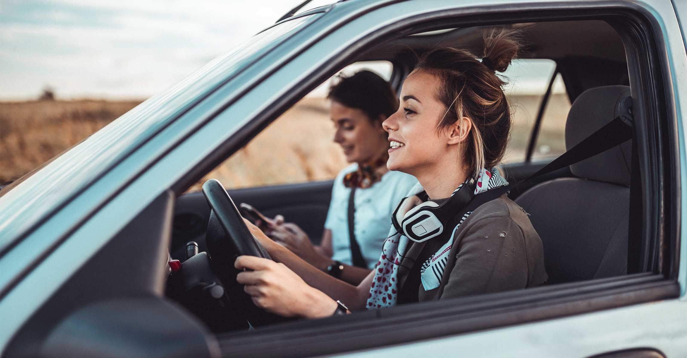 women in a car