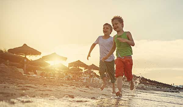 Children running on beach