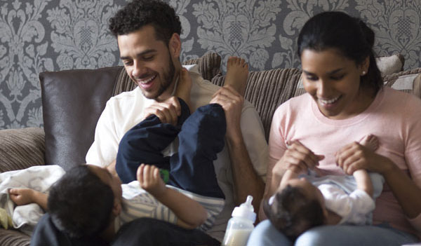 Parents playing with children