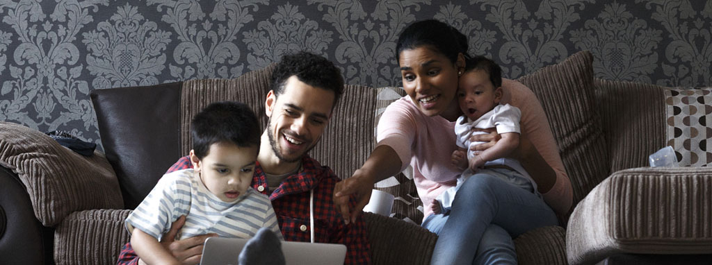 Family playing on sofa