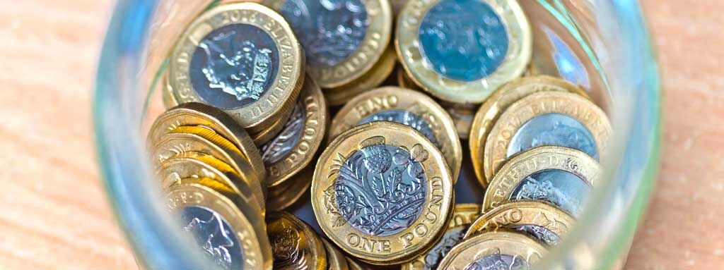 Pound coins in jar