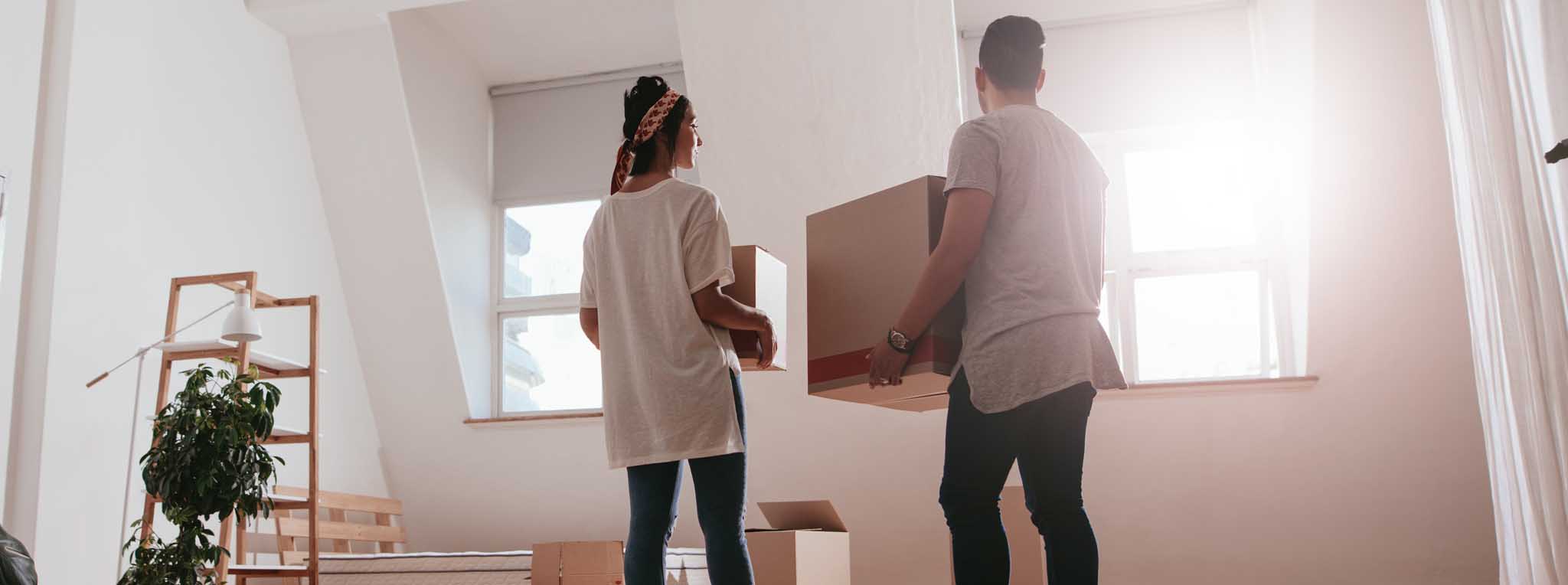 couple with man holding box