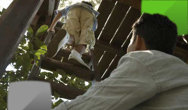 child in tree house