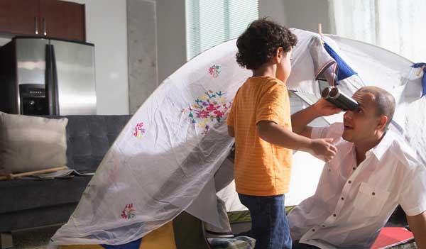 Man and boy in tent