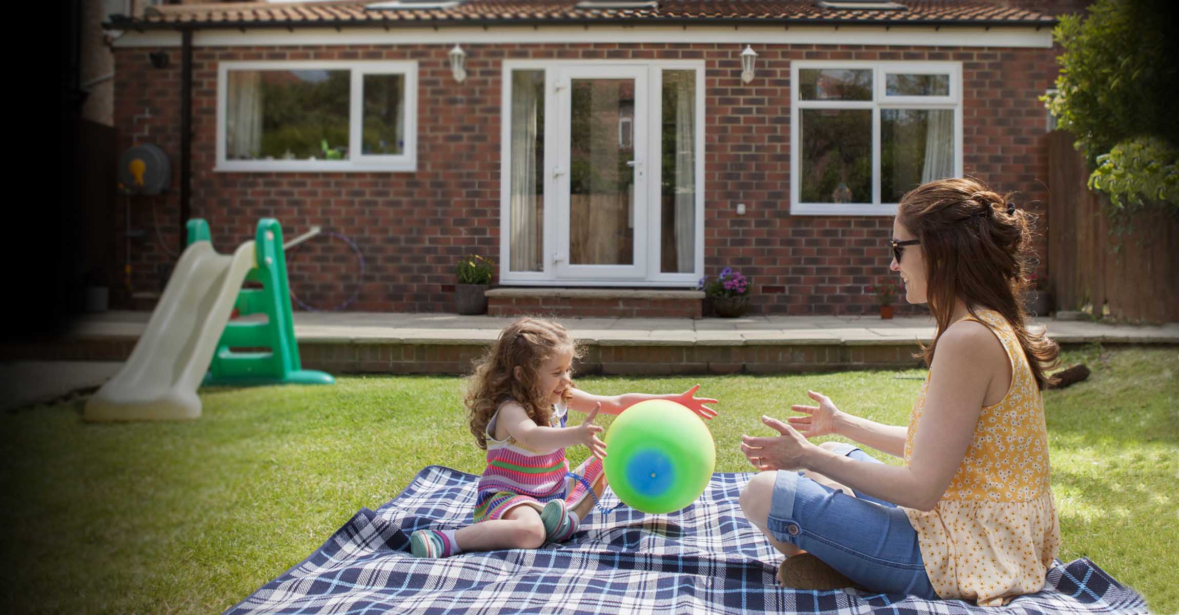 Woman and child playing outside