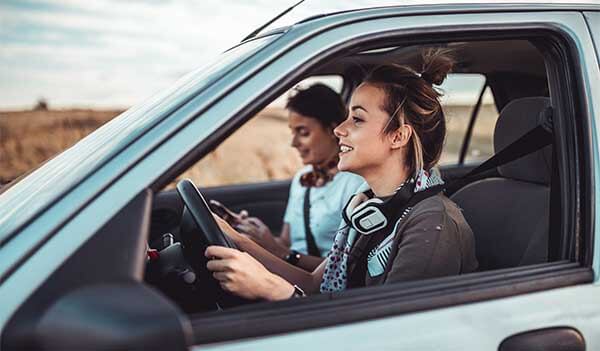 Young women in car going for a drive